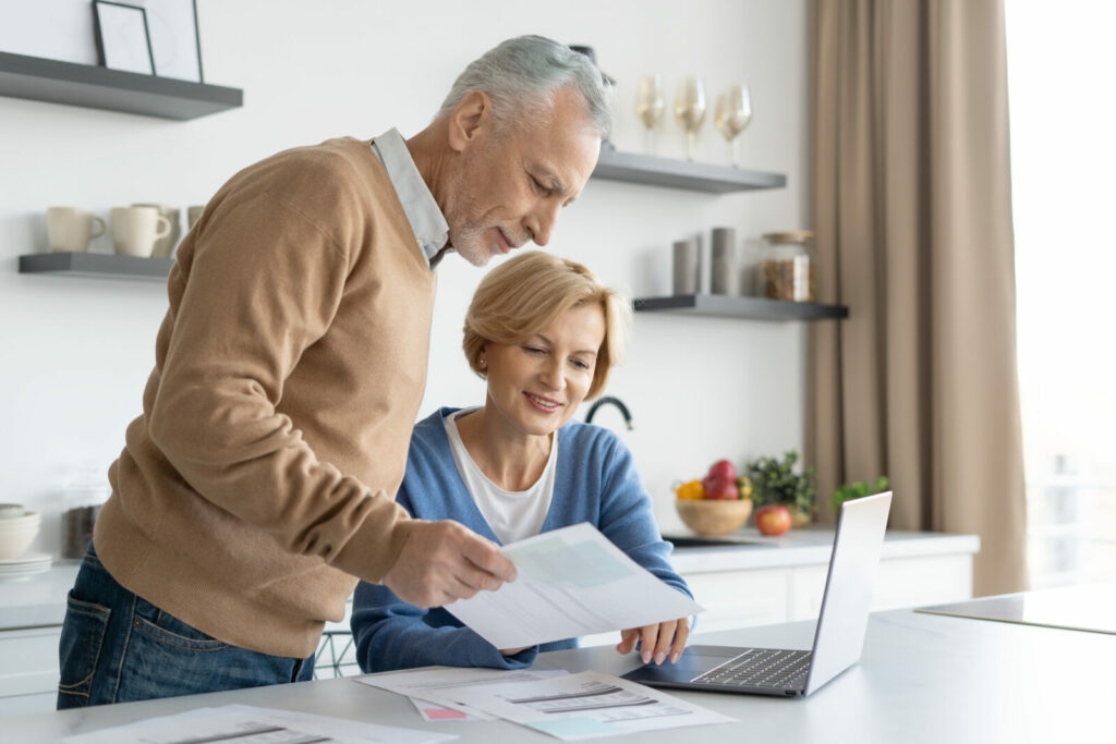 Couple checking finance account and papers